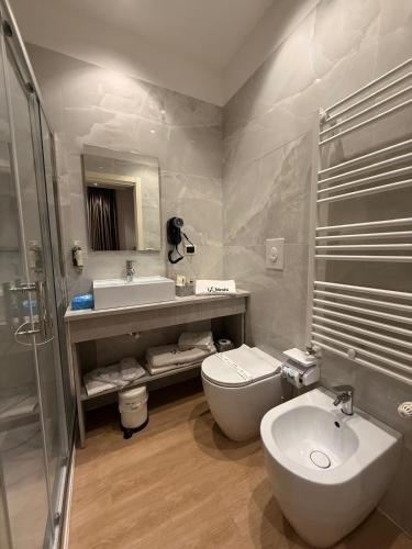 a bathroom with a sink and a toilet and a shower at LaBienbi' in Cosenza