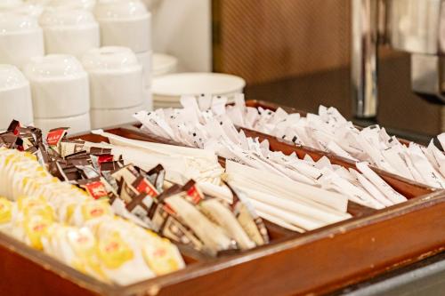 a tray of uncooked food on a counter with milk at Emaar Elite Al Madina Hotel in Al Madinah