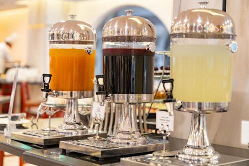 a couple ofbeer siphons sitting on top of a counter at Emaar Elite Al Madina Hotel in Al Madinah