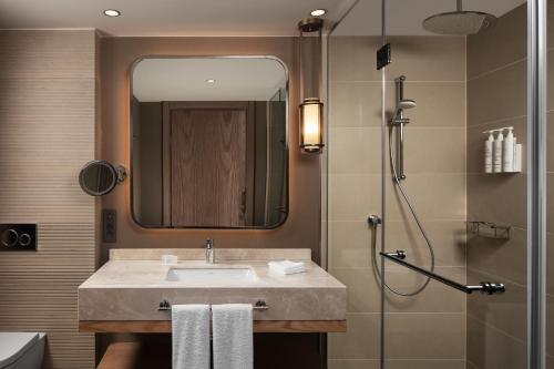 a bathroom with a sink and a shower at Cappadocia Marriott Hotel in Nevsehir