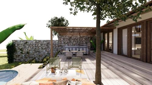 a deck with a couch and chairs next to a pool at Yazz Collective in Fethiye