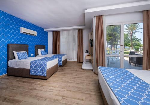 Postel nebo postele na pokoji v ubytování Amara Comfort Resort