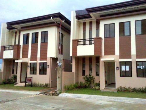 a large building with a street in front of it at Momently in Lapu Lapu City
