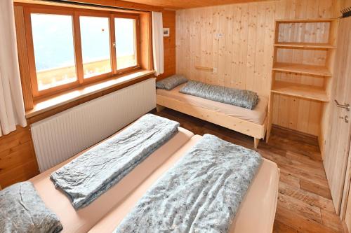 Postel nebo postele na pokoji v ubytování Berghof Burtscher Niklas