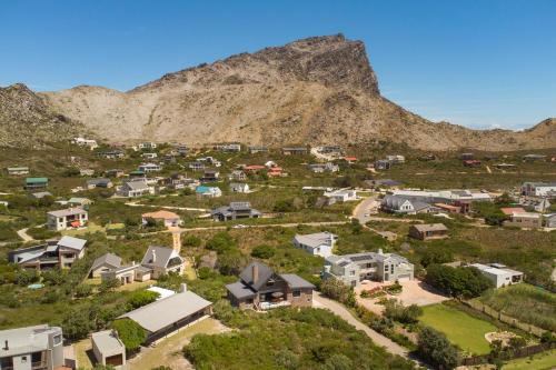 an aerial view of a village in a mountain at Secure, luxurious with lovely views in Pringle Bay