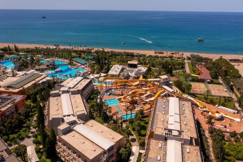 an overhead view of a water park with a roller coaster at AQI Pegasos World in Side