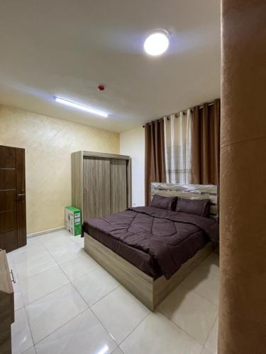 a bedroom with a large bed in a room at Osama Alnaser in Amman