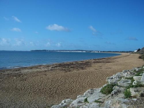 an empty beach with rocks and the ocean at Get-a-Wey a static caravan at Haven Weymouth Bay in Preston