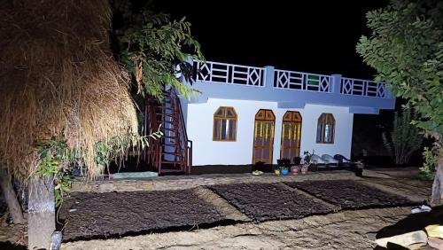 a model of a house at night at Dwarahat Village Farmstay- Babaji's Cave in Dwārāhāt