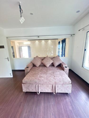 a large bedroom with a large bed in a room at Luxury Villa in Heart of the city in Haidar Sāhibgūda