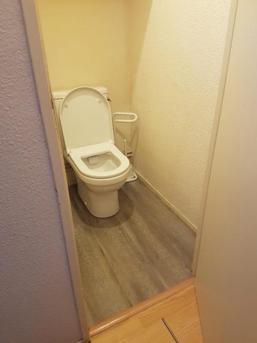 a bathroom with a toilet with the lid up at Fontaines Blanches 320 in Avoriaz