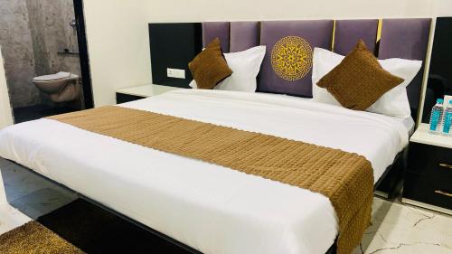 Postel nebo postele na pokoji v ubytování Stay 10 Parallel Apartment Hotel