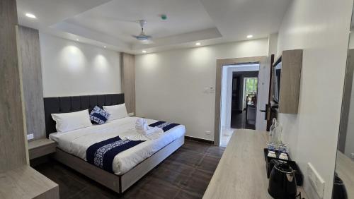 a bedroom with a bed in a room at Hotel Akshaya in Port Blair