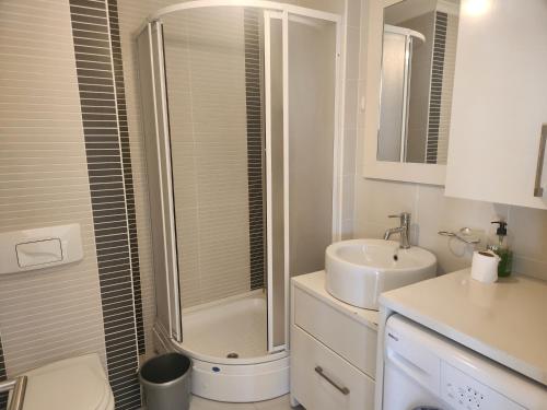 A bathroom at Antalya belek 4 nirvana club first floor two bedrooms pool view with water slide close to center - belek beach park