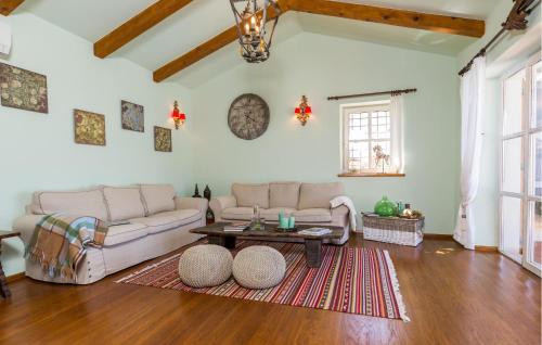 a living room with a couch and a table at Stunning Home In Barat in Barat