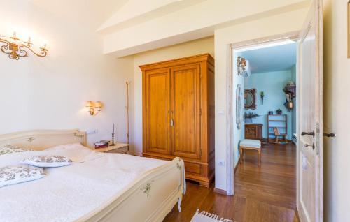 a bedroom with a bed and an open door at Stunning Home In Barat in Barat