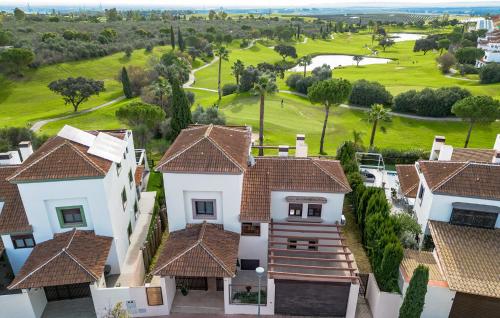 an aerial view of a house with a golf course at Nice Home In Guillena With Wifi in Guillena
