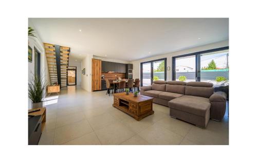 a living room with a couch and a table at 4 Bedroom Stunning Home In Murter in Murter
