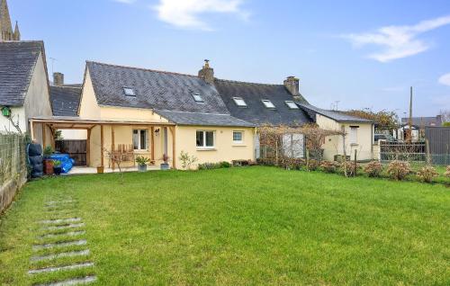 a house with a lawn in front of it at 2 Bedroom Cozy Home In Plumieux in Plumieux