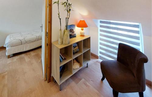a bedroom with a desk and a chair and a bed at 2 Bedroom Cozy Home In Plumieux in Plumieux