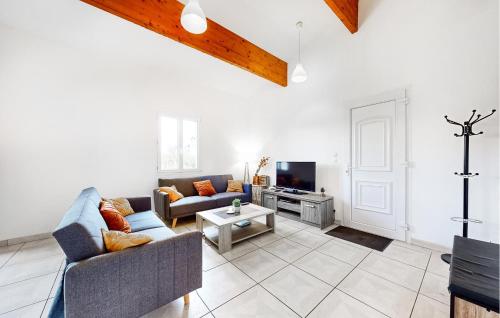 a living room with a couch and a tv at Stunning Home In Bussière-Badil in Bussière-Badil