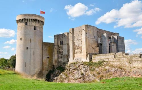 a castle with two towers on top of a hill at Lovely Home In Mézidon Vallée D'auge in Ouville-la-Bien-Tournée