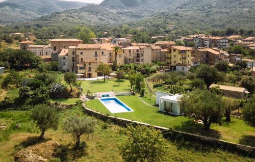 an aerial view of a village with a house and a swimming pool at Amazing Home In Vallo Della Lucania in Vallo della Lucania