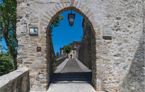 an archway in a stone wall with a staircase at Luxurious Home In Monterchi in Monterchi