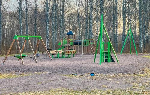 an empty playground with a swing set in a park at Lovely Home In Fengersfors With Wifi in Fengersfors