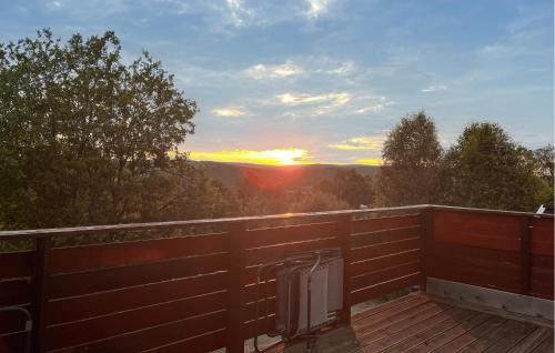 a view of the sunset from the deck of a house at 3 Bedroom Beautiful Apartment In Røros in Røros