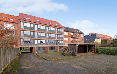 an empty parking lot in front of a building at Nice Apartment In Esbjerg With Wifi in Esbjerg