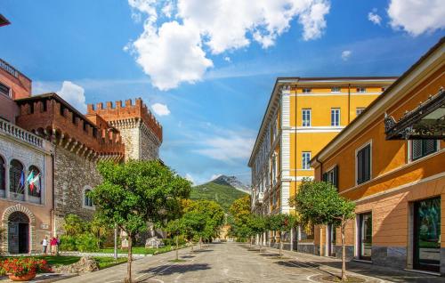 an empty street in a city with buildings at Lovely Home In Passo Del Cerreto in Cerreto Laghi