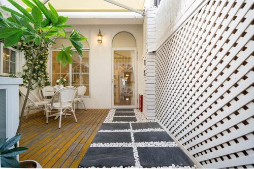 an outdoor patio with a table and chairs at Tonight Homestay Jing'an Temple Branch Shanghai in Shanghai