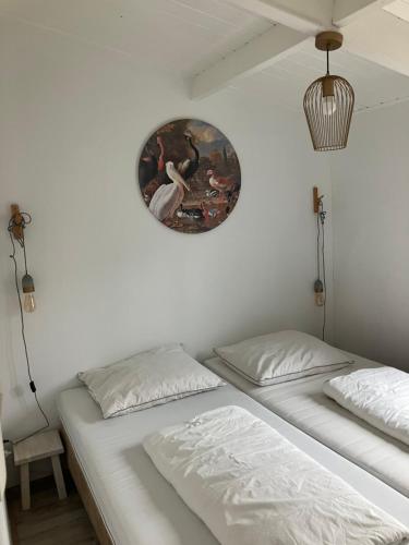 Postel nebo postele na pokoji v ubytování Huisje56