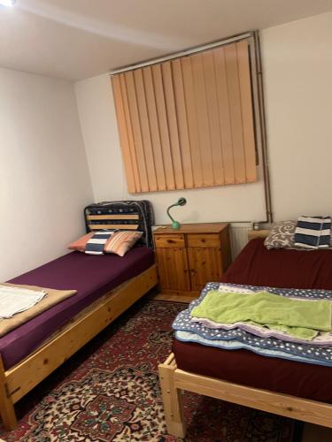 Ein Bett oder Betten in einem Zimmer der Unterkunft Slobo