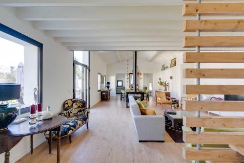 a living room with a staircase and a living room at Casa do Carvalhal - Quinta do Soldado in Alquerubim