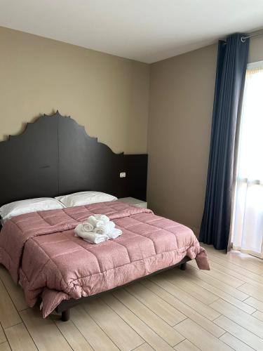 Postel nebo postele na pokoji v ubytování Fiamma suites