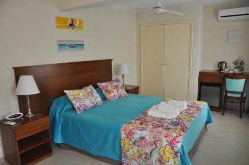 Ένα ή περισσότερα κρεβάτια σε δωμάτιο στο Hotel Victoria