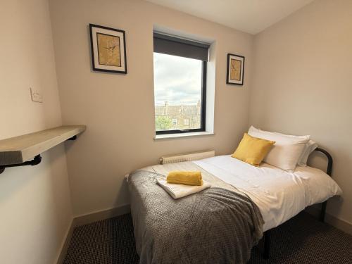 Katil atau katil-katil dalam bilik di Buxton Road Suites