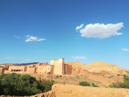 an old building on a hill in the desert at Gite Amoudou in Ouarzazate