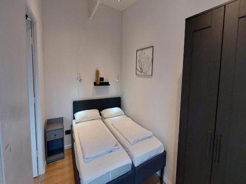 Ένα ή περισσότερα κρεβάτια σε δωμάτιο στο Pretty bungalow in Sint Maartenszee