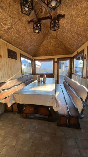 a large room with two beds and windows at Five House in Skhidnitsa