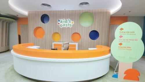 a exhibit of a waiting room with an orange counter at Seaside Elegance- À la carte Hotel Hạ Long in Ha Long