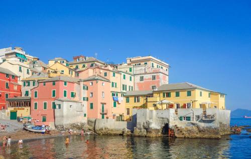 a group of colorful buildings next to the water at Pet Friendly Home In Ne in Ne