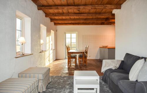 a living room with a couch and a table at Lovely Home In Skivarp With Wifi in Skivarp