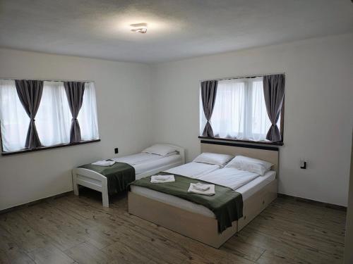 Katil atau katil-katil dalam bilik di Birta Guesthouse