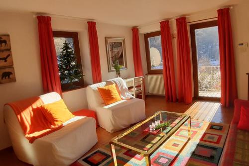 a living room with two couches and a coffee table at Issime - da Carla (CIR n. 0001) in Issime