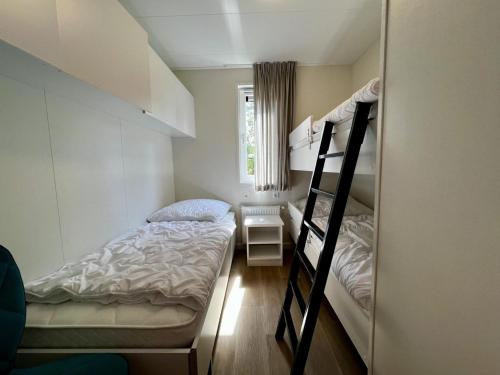 Ένα ή περισσότερα κρεβάτια σε δωμάτιο στο Unique chalet for 5 with garden