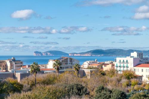 a city with the ocean in the background at I Tramonti in Alghero