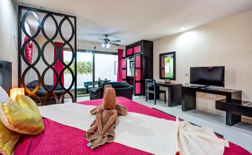 TV tai viihdekeskus majoituspaikassa Suites Corazon